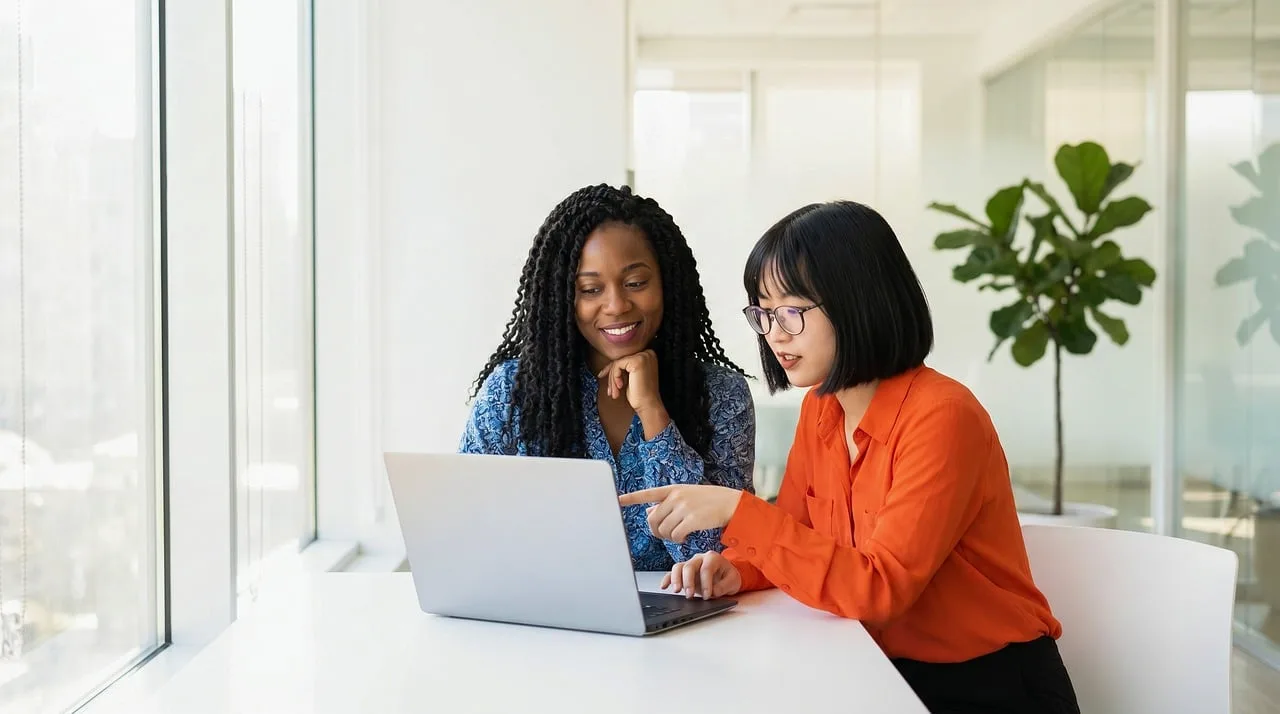 women, diversity, collaboration, teamwork, laptop, office, learning, technology, discussion, meeting, smiling, professional, colleagues, training, modern, workplace, pointing, support, mentoring